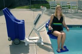 girl using mobility device to get into pool