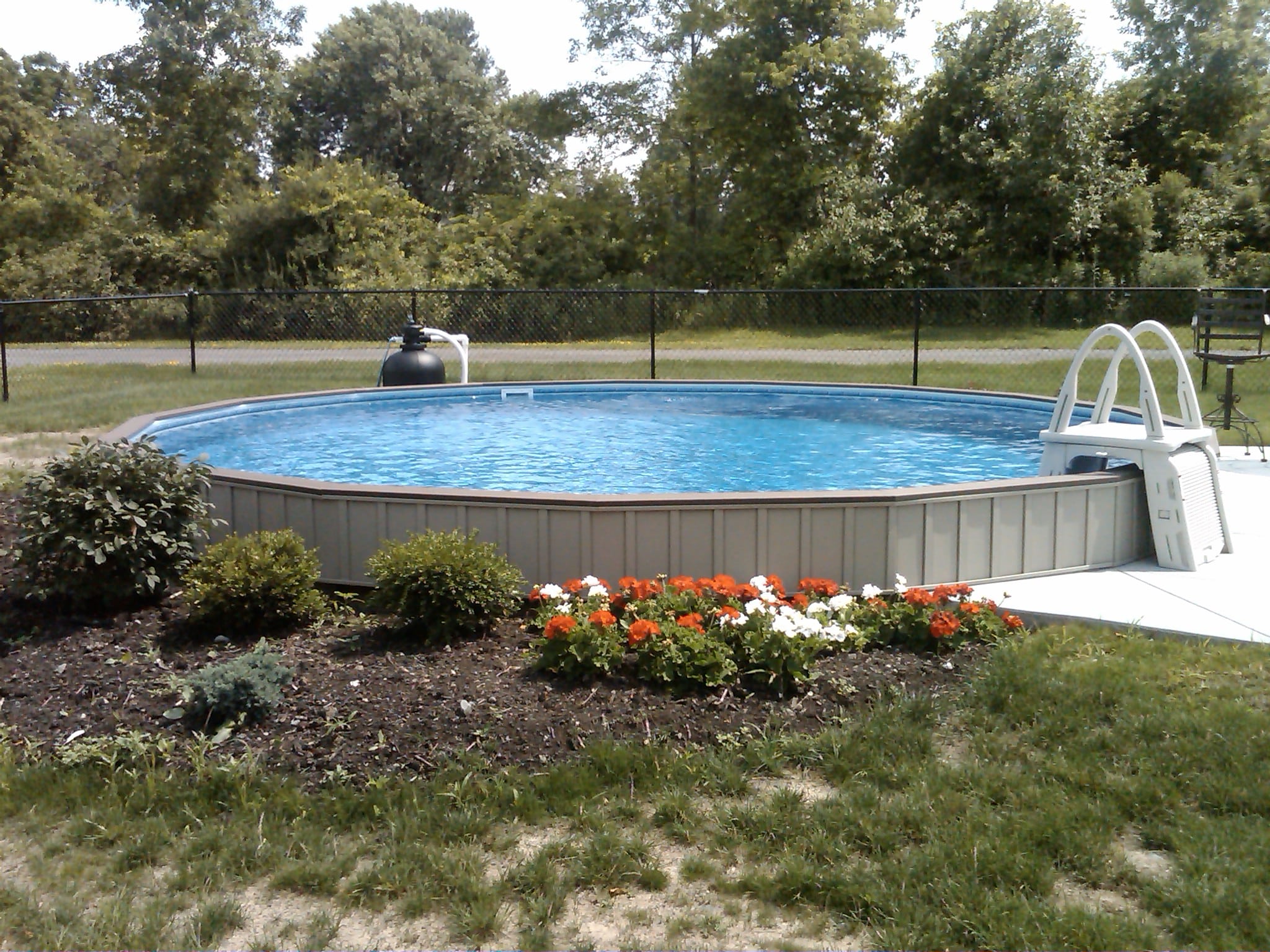 half inground half above ground pool, oval